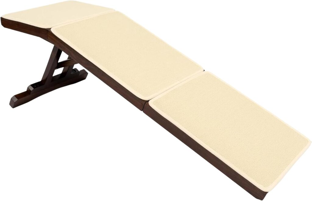 Small senior dog using the PetSafe CozyUp wooden bed ramp beside a bed